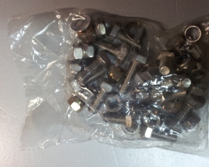 Fastening kit for piglet feeder w/ lateral flat iron